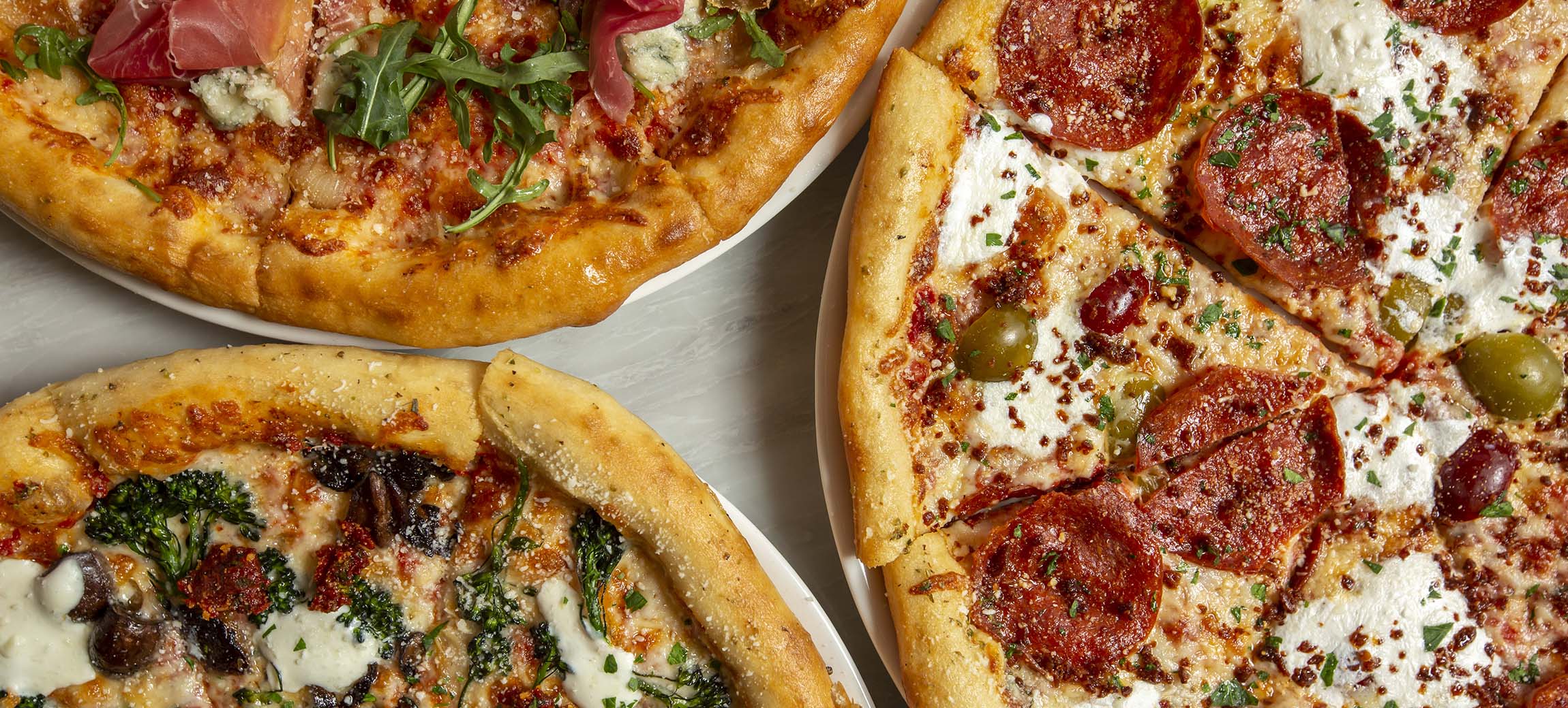 Trio of pizzas created at Valentina's at Bridge Park in Dublin, Ohio.